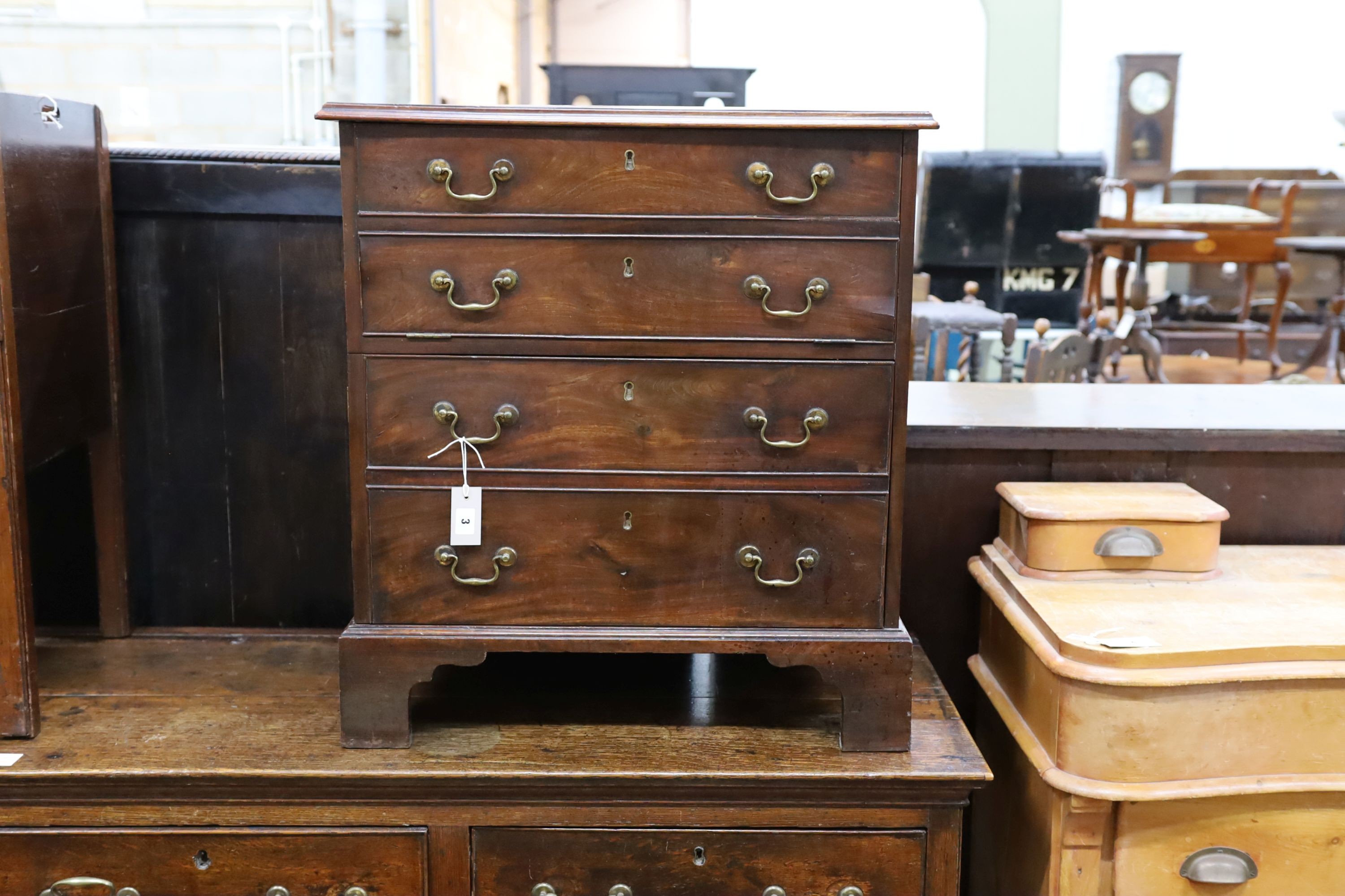 A small George III mahogany chest converted to a drinks cabinet, width 70cm, depth 45cm, height 77cm